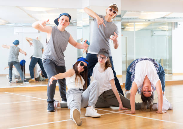 istock Teens hip hop dancers posing in studio 1303735851