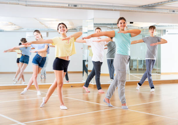istock Teenage dancers practicing new dance in studio 1303735861