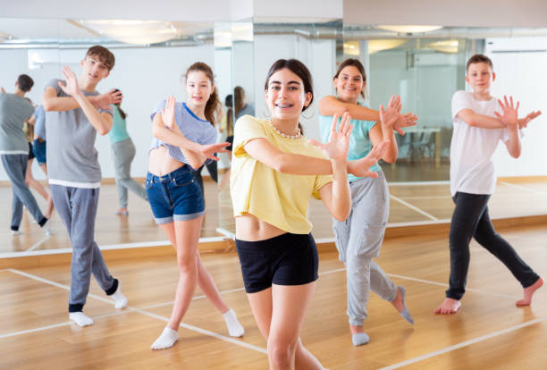 istock Teenagers in dance hall studying new movements 1303735893