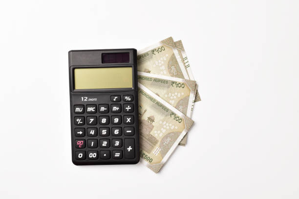 Calculator with Indian money isolated on white background with clipping path
