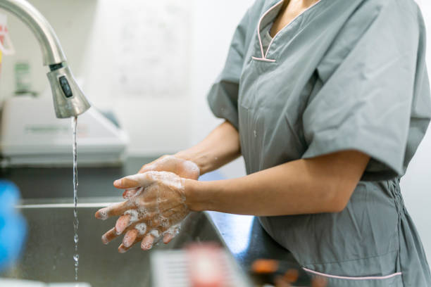 istock Medical professional washing hands 1303736981