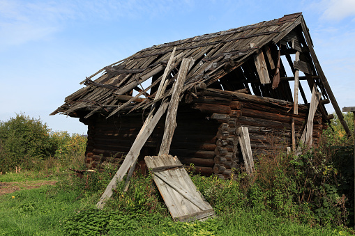 Abandoned, useless wooden house or barn. Falling apart structure. Architectural screensaver.