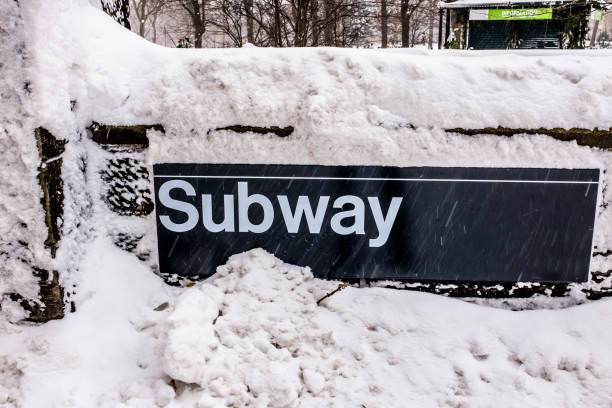 istock Subway sign covered by snow 1303739463