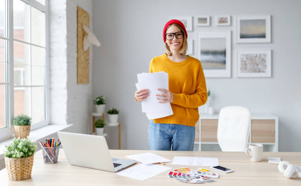 happy young woman with documents during work - 16207 imagens e fotografias de stock