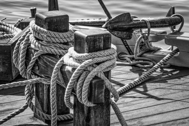 istock Black and White sailboat rigging and anchor. 1303741659