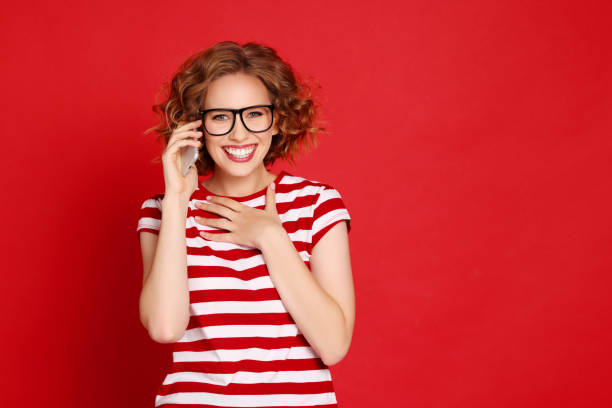 istock Surprised woman speaking on smartphone 1303742184