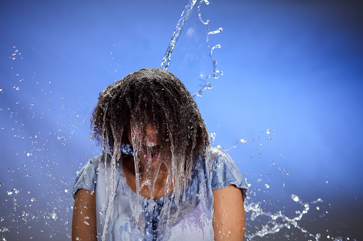African american woman after splash of water for top.