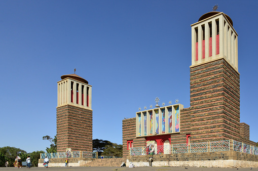 Asmara, Eritrea: Saint Mary / Enda Mariam Coptic Cathedral, built in 1920 and modified in 1938, designed in rationalist / modernist style by architect Ernesto Gallo and civil engineer Odoardo Cavagnari - alternate layers of brick and stone, evoking the layers of wood and stone of Aksumite architecture, 'monkey heads' technique - Italian colonial perior - Eritrean Orthodox Tewahedo Church - Asmera, a Modernist City of Africa - UNESCO World Heritage Site.