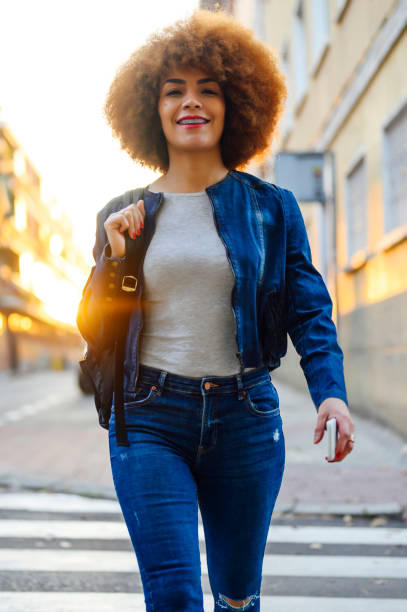 istock smiling afro american woman looking at camera 1303749078