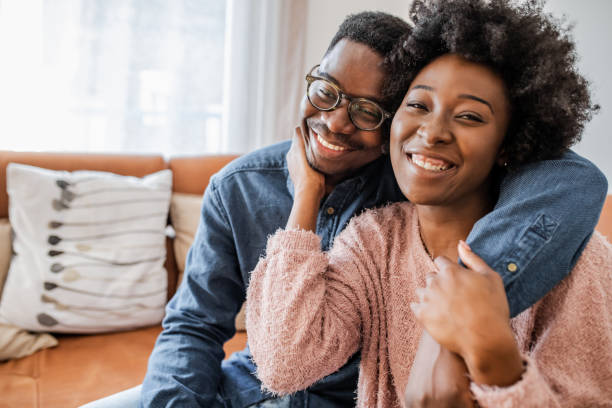 istock Cute African American couple at home 1303749096