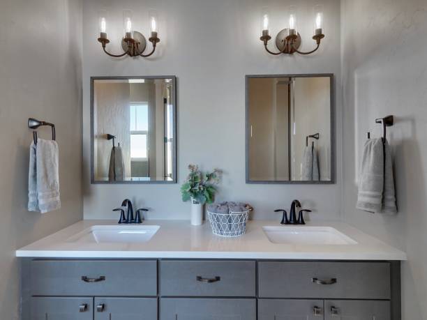 Modern Master Bathroom Light And Dark Grey Home Interior Real Estate Listing Straight On View Staged stock photo
