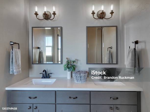 Modern Master Bathroom Light And Dark Grey Home Interior Real Estate Listing Straight On View Staged Stock Photo - Download Image Now