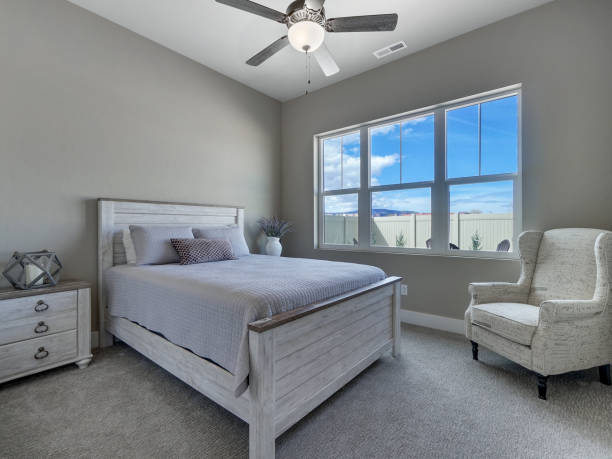 Modern Guest Bedroom Staged With New White Furniture stock photo