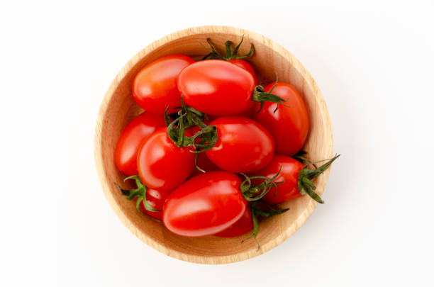 istock Fresh cherry tomatoes aiko in Wooden bowl on white background 1303750149