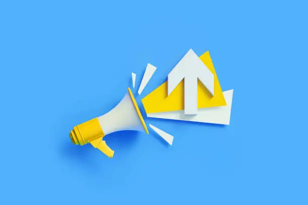 Photo of Up Arrow Symbol Coming Out From Yellow Megaphone On Blue Background