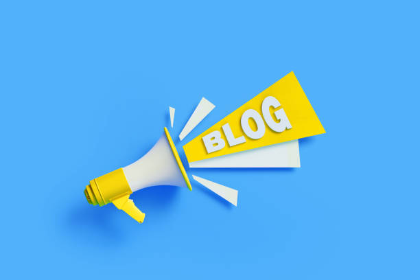 istock Blog Coming Out From Yellow Megaphone On Blue Background 1303753866