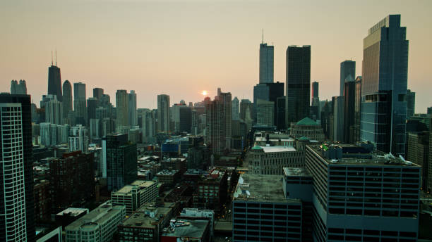 istock Drone Flight Looking Over Downtown Chicago Towards Rising Sun 1303756910
