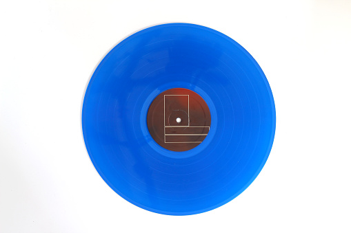 Blue Vinyl record on a white background. Retro style. Top view.