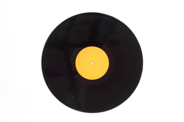 istock 12-inch LP vinyl record disk with blank red label. Close-up shot, top view 1303757851
