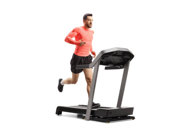 uomo in forma che corre su un tapis roulant - treadmill exercise machine isolated exercising foto e immagini stock