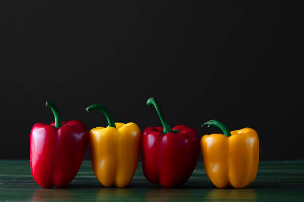 healthy organic vegetables, Colored Bell peppers on dark background