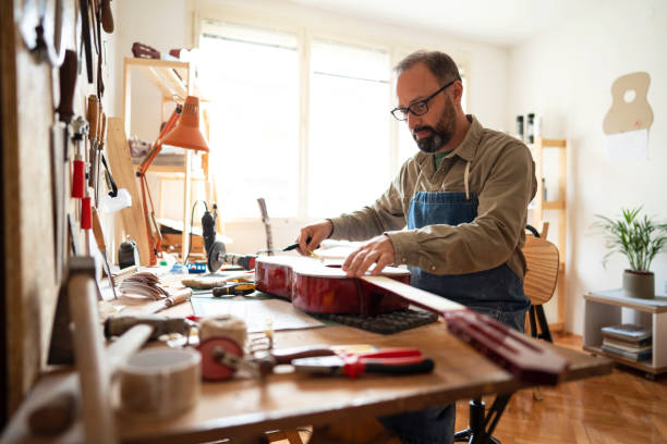 Craftsman repairing the classical guitar