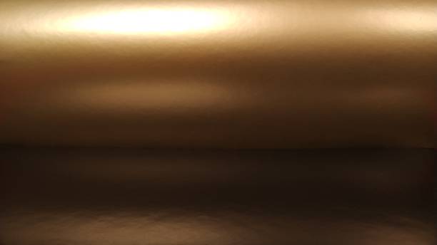 istock Gradient on a brown background. Horizontally folded shiny paper or foil with overflow and glare. Soft brown and beige color. Mysterious radiance. Northern Lights. Metallic gold glitter. Banner 1303762463