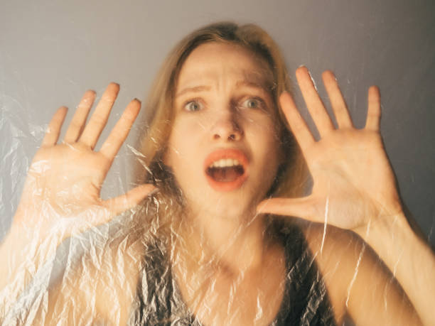 istock covid-19 self isolation defocused portrait woman 1303762495