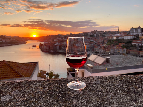 a glass of red view on the observation deck with a sunset view