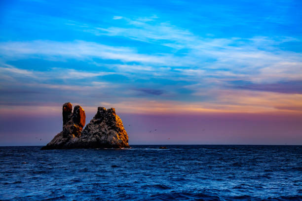 Split Rock smallest of four Revillagigedo Islands Roca Partida or Split Rock smallest of the four Revillagigedo Islands, part of the Free and Sovereign State of Colima in Mexico revillagigedos islands stock pictures, royalty-free photos & images