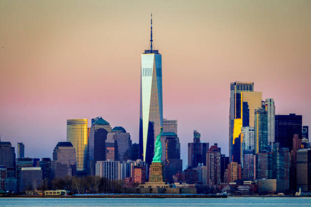 Statue of Liberty with Manhattan in the background The Statue of Liberty with Lower Manhattan in the background statue of liberty new york city photos stock pictures, royalty-free photos & images