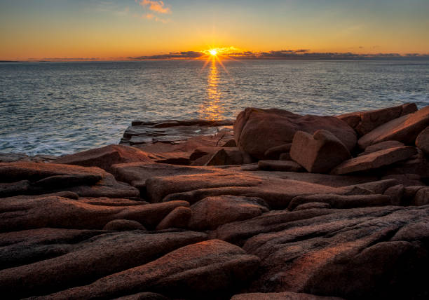 istock Sunrise Over Atlantic Ocean along Maine Rocky Shore 1303766183