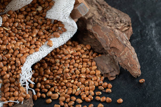 istock Brown kidney beans isolated on a dark background 1303766743