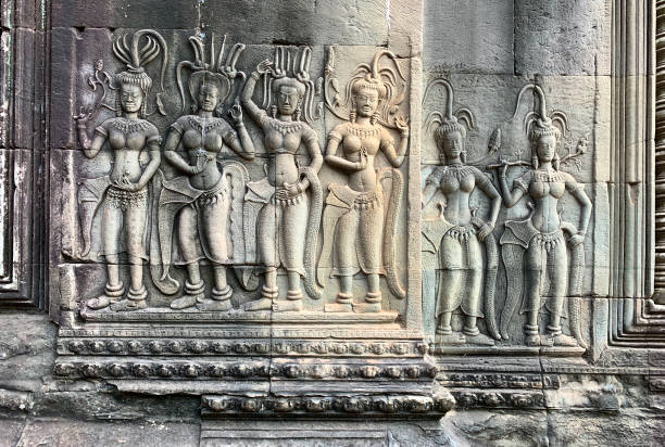 Siem Reap, Cambodia - January 20, 2020: Deep relief of dancing Apsaras at Angkor Wat temple, Cambodia. The Angkor Wat is a Hindu temple complex in Cambodia and is the largest religious monument in the world.