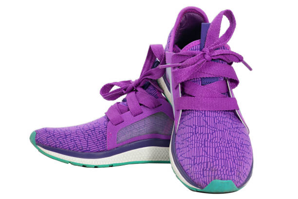 istock purple running shoe isolated on white 1303773444