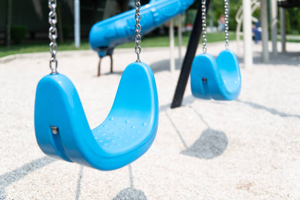 Empty Chain Swings in Children Playground