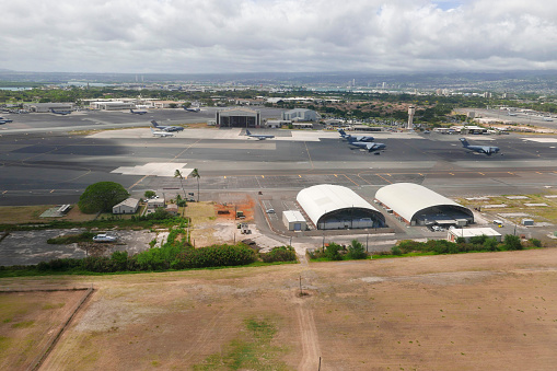 Aerial view of Hickam Air Field with military aircrafts on the ground at Joint Base Pearl Harbor-Hickam, Honolulu, Hawaii in May 2018