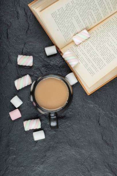 istock A cup of coffee with marshmallows and book 1303776660