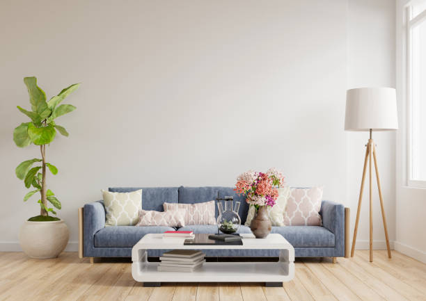 istock Modern living room interior design a blue sofa on empty white wall background. 1303778540