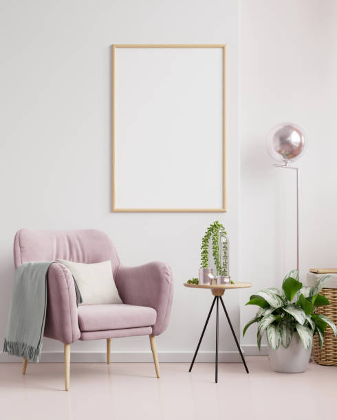 istock Poster mockup with vertical frames on empty white wall in living room interior with blue velvet armchair. 1303778602