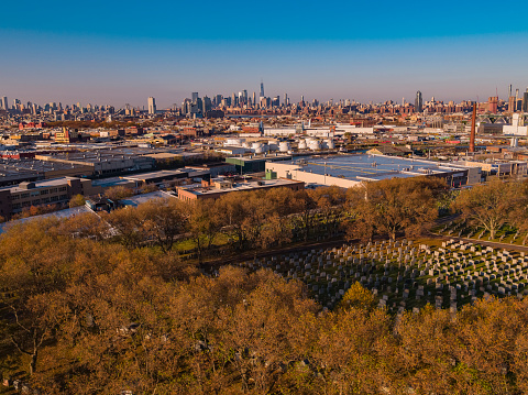 Calvary Cemetery, Queens, with the remote view of Manhattan in the backdrop.