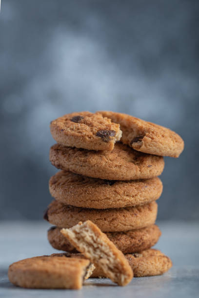 istock Delicious cookies with chocolate on a gray background 1303780902