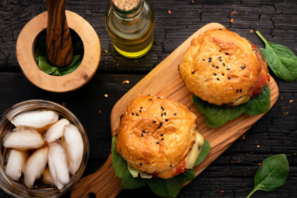 istock Classic Burger on wooden cutting board 1303785141