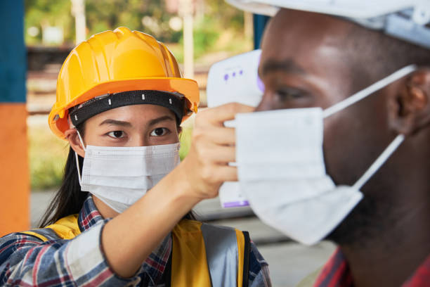 istock Factory workers are screened for the disease. 1303787981