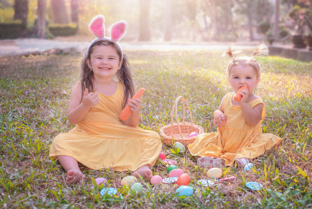 istock Children eat carrots on the grass 1303790000