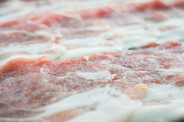 istock Freshness slided pork on white dish for grill or boil 1303790846