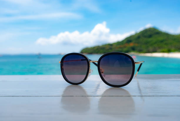 istock sun glasses and beach 1303792674