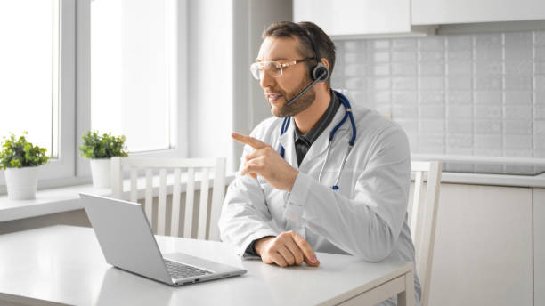 istock Doctor during an online video call. Format 16:9 1303797004