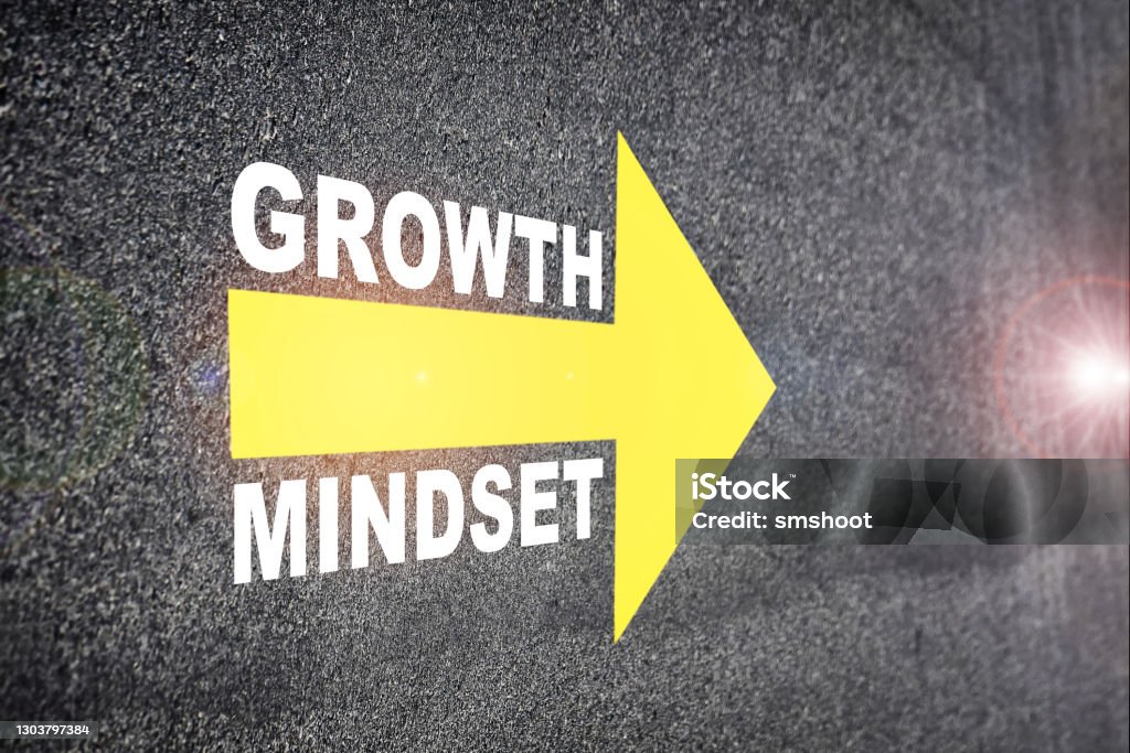 Growth mindset with yellow arrow marking on road surface Self development to success concept and challenge idea Attitude Stock Photo