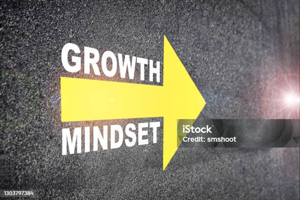 Growth Mindset With Yellow Arrow Marking On Road Surface Stock Photo - Download Image Now